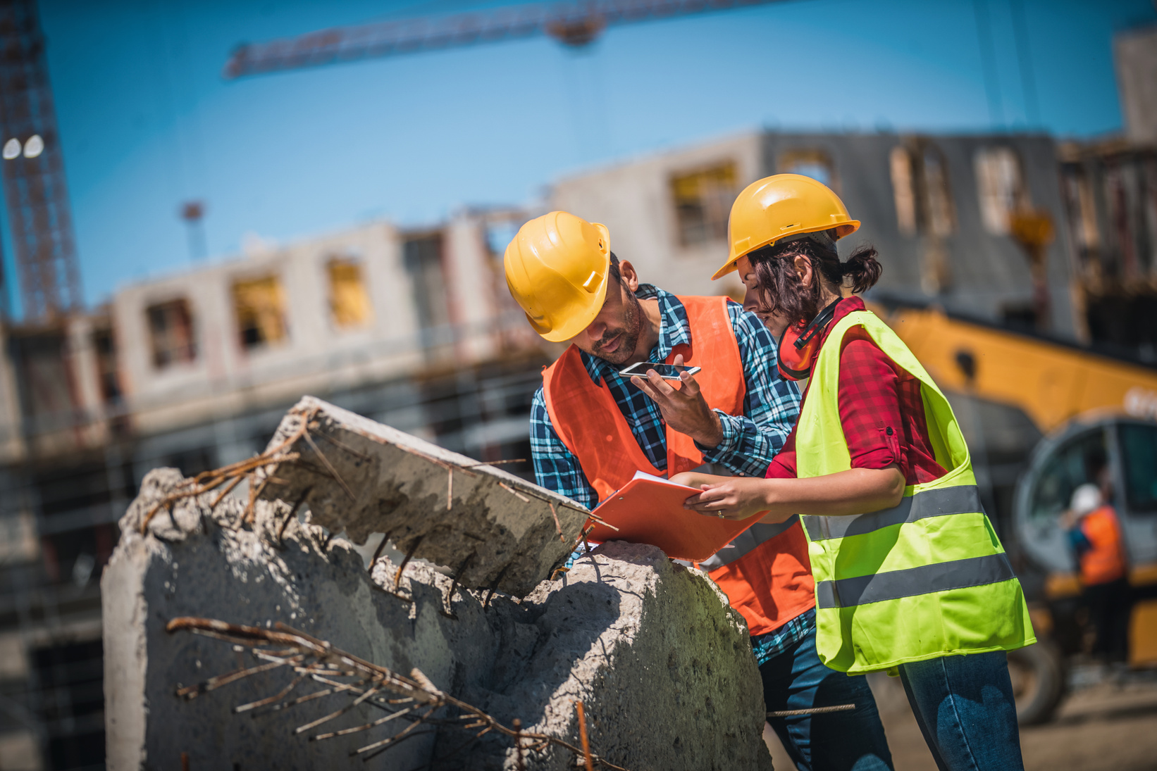 Construction professionals reviewing project plans together